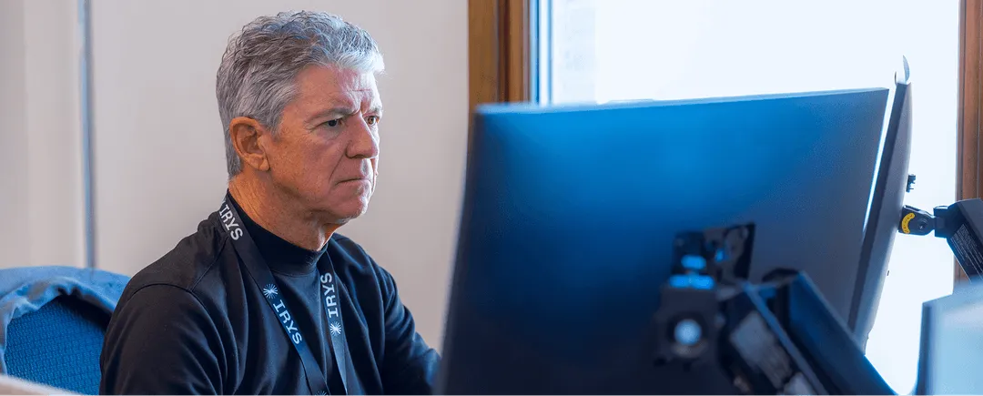 Irys employee working on computer